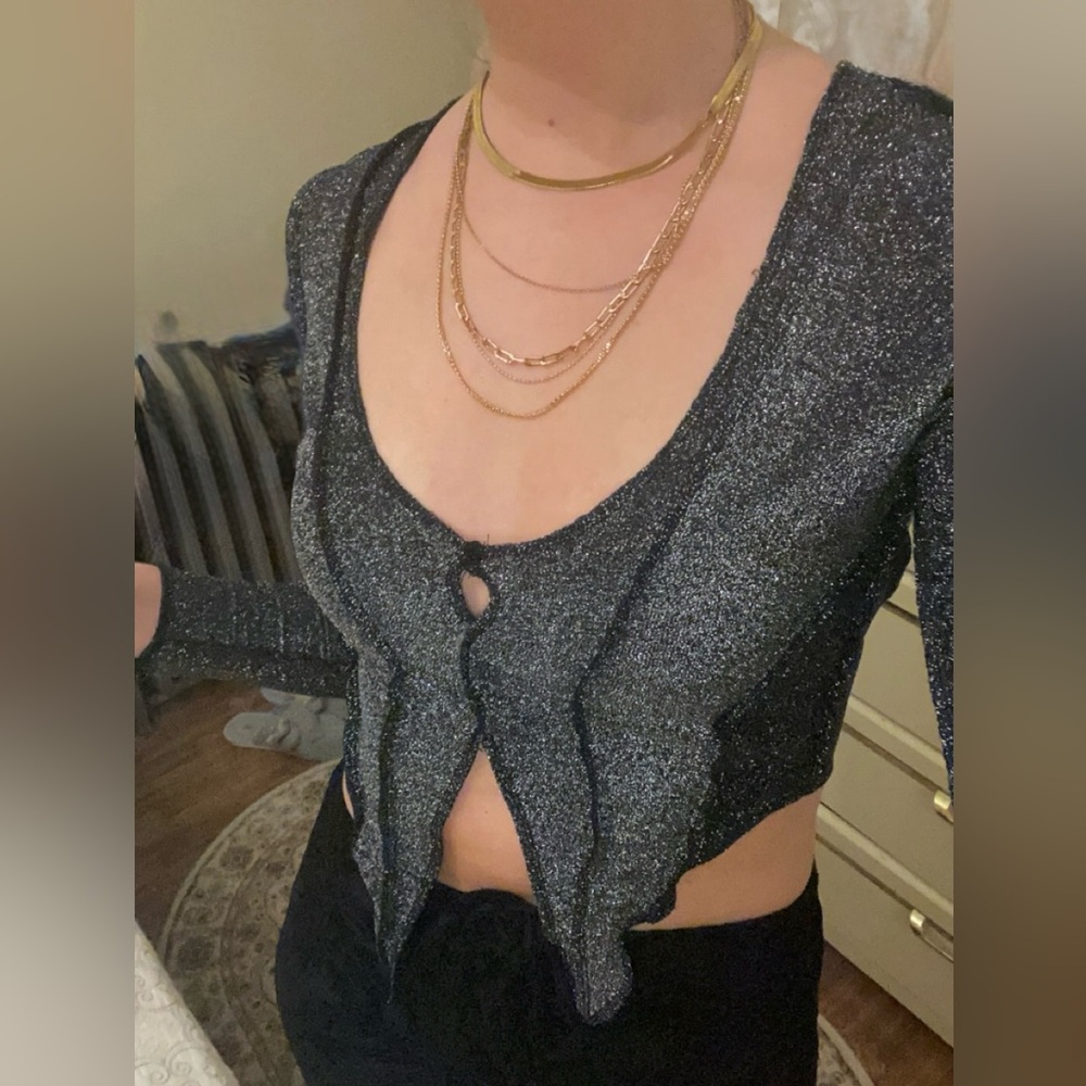 Sparkly cropped long sleeve open front top
